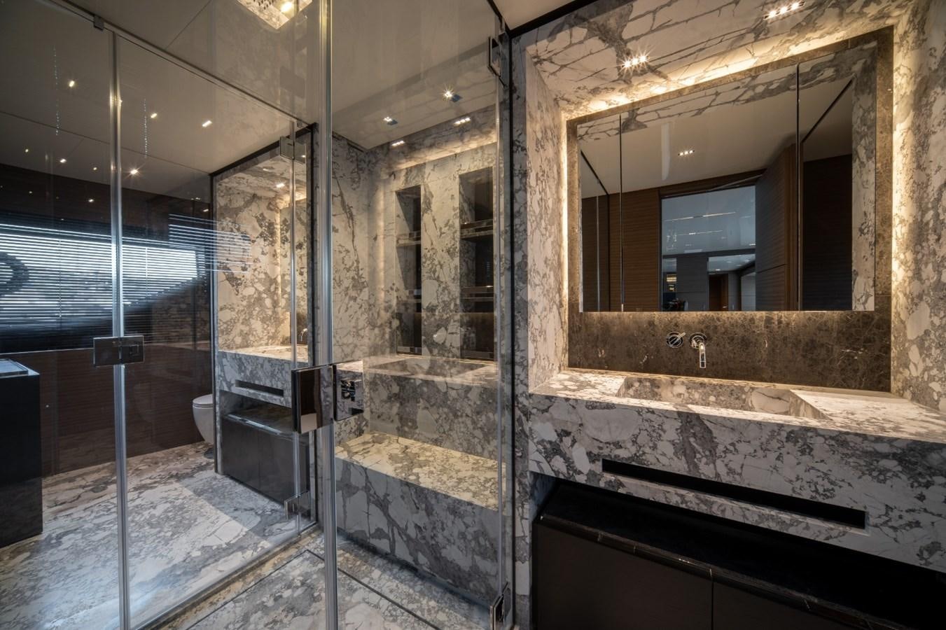 a bathroom with a large mirror aboard CUSTOM LINE NAVETTA 42/11 Yacht for Sale