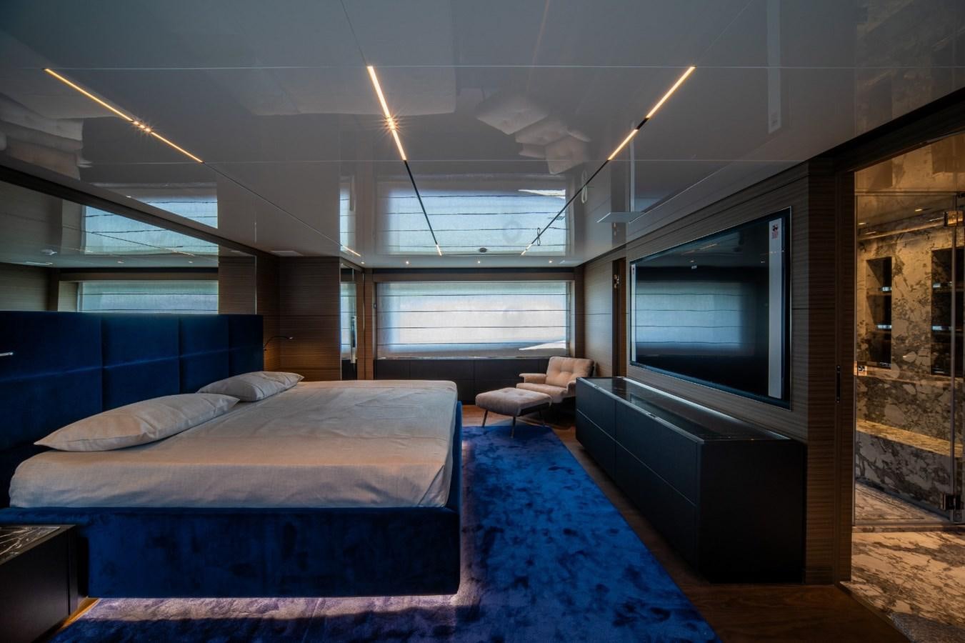 a bedroom with a large bed aboard CUSTOM LINE NAVETTA 42/11 Yacht for Sale