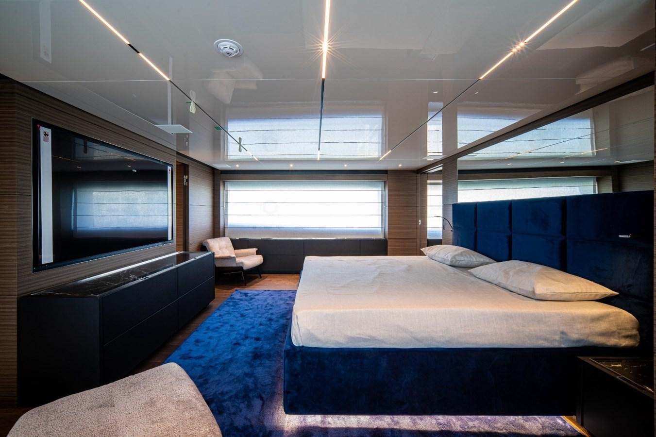 a room with a bed and a tv aboard CUSTOM LINE NAVETTA 42/11 Yacht for Sale