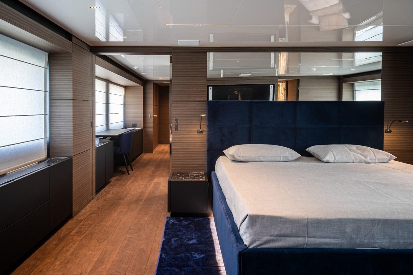 a bed in a room aboard CUSTOM LINE NAVETTA 42/11 Yacht for Sale