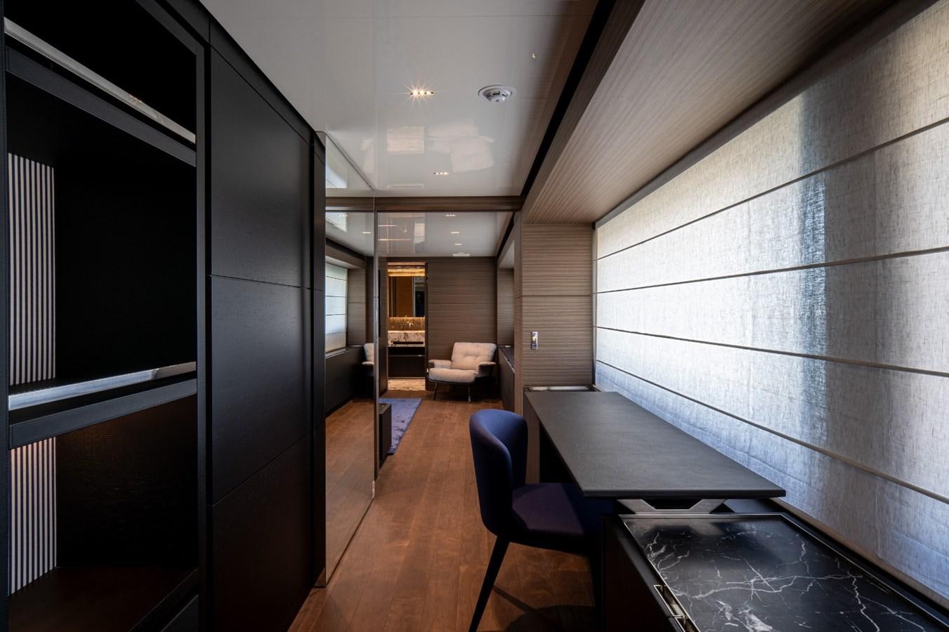 a room with a table and chairs aboard CUSTOM LINE NAVETTA 42/11 Yacht for Sale