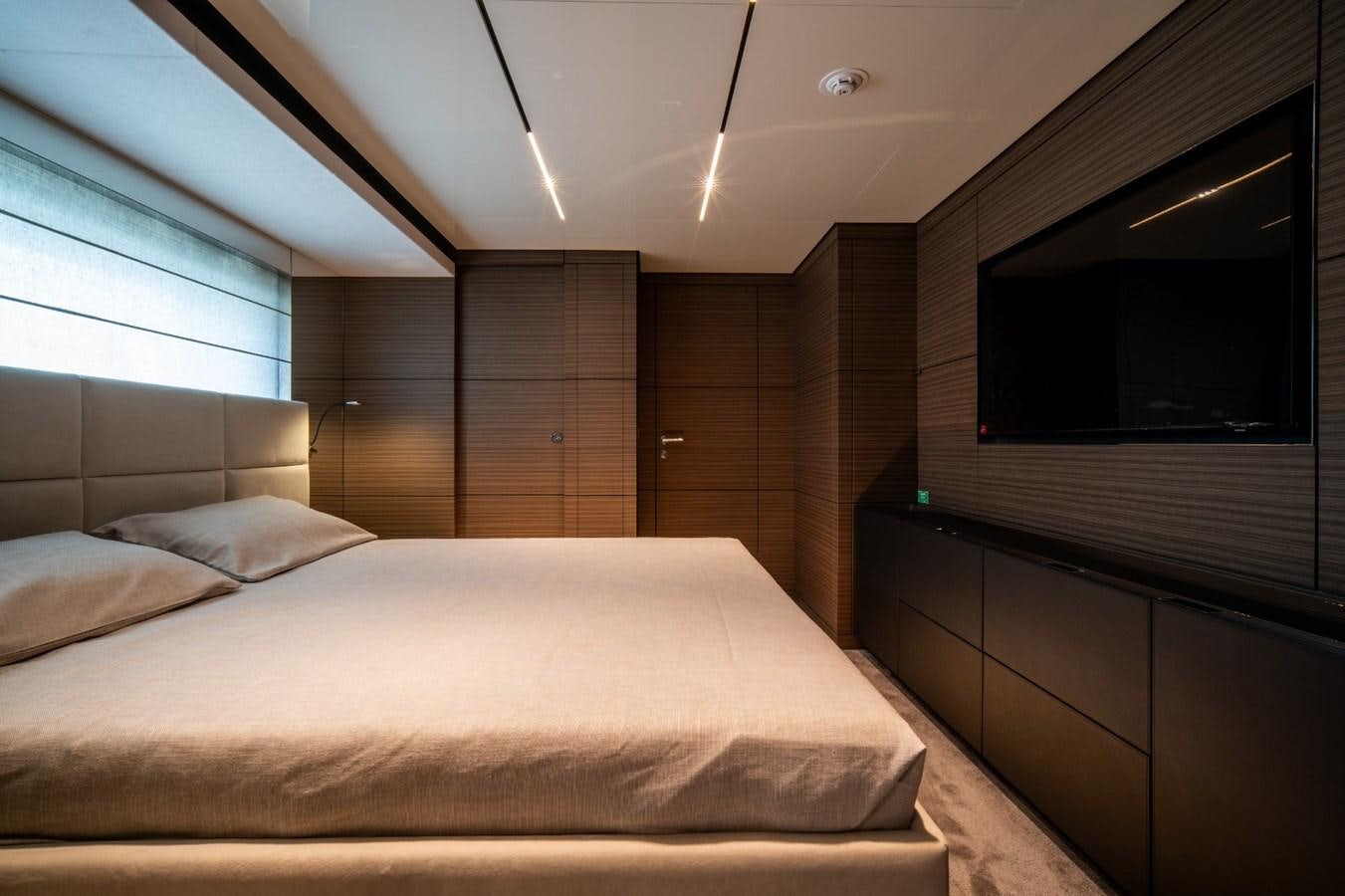 a room with a bed and a tv aboard CUSTOM LINE NAVETTA 42/11 Yacht for Sale