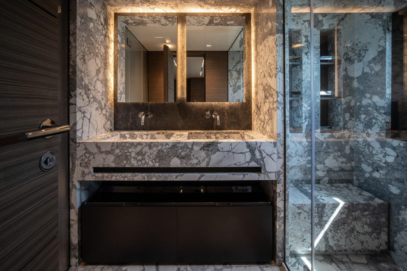 a bathroom with a large mirror aboard CUSTOM LINE NAVETTA 42/11 Yacht for Sale