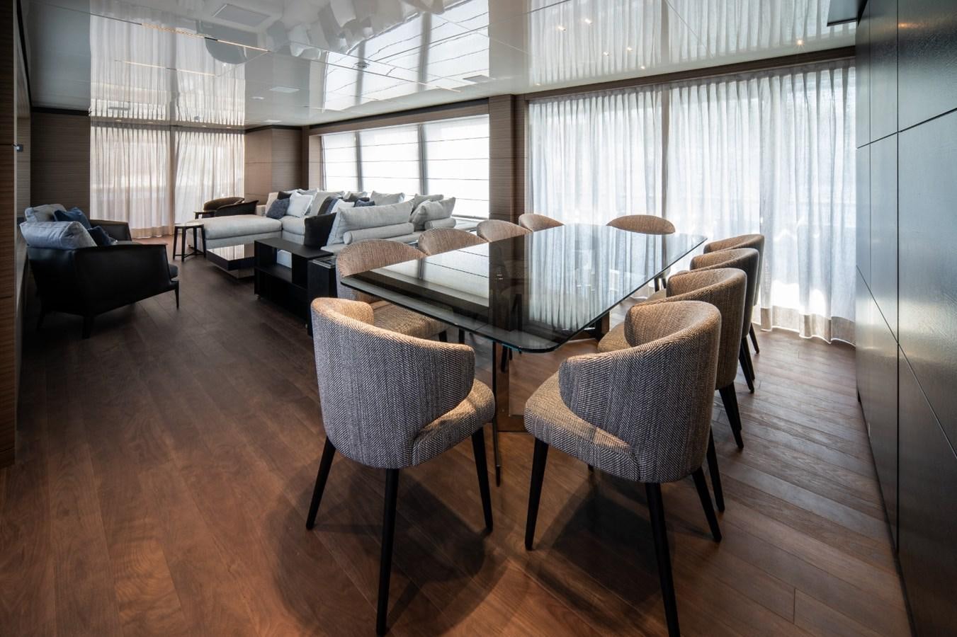 a living room with a table and chairs aboard CUSTOM LINE NAVETTA 42/11 Yacht for Sale