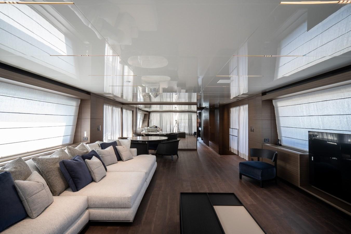 a living room with a couch and a fireplace aboard CUSTOM LINE NAVETTA 42/11 Yacht for Sale
