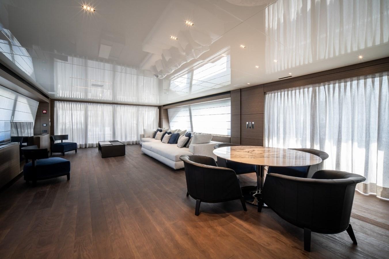 a living room with a table and chairs aboard CUSTOM LINE NAVETTA 42/11 Yacht for Sale