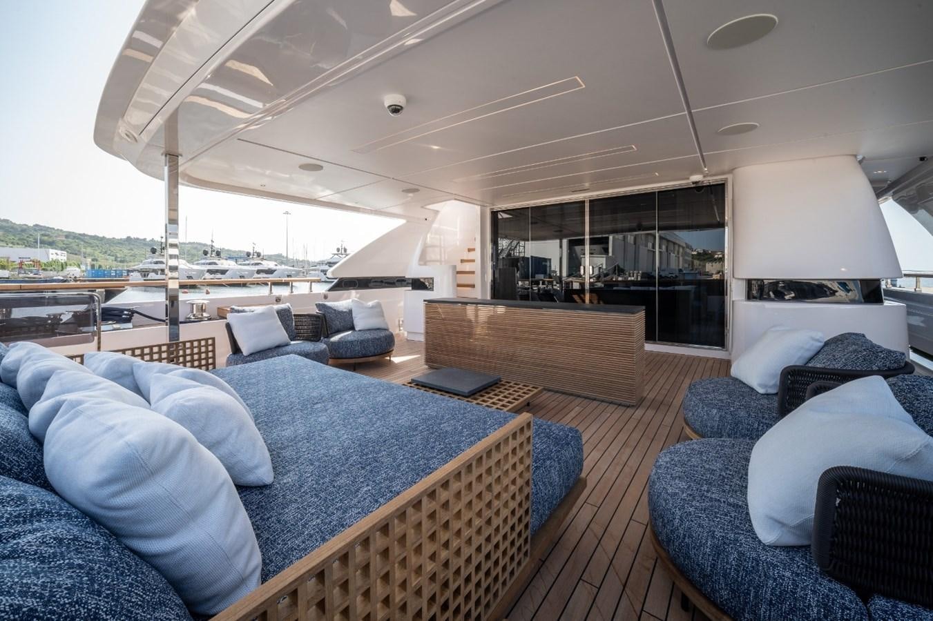 a large living room with a large open window aboard CUSTOM LINE NAVETTA 42/11 Yacht for Sale