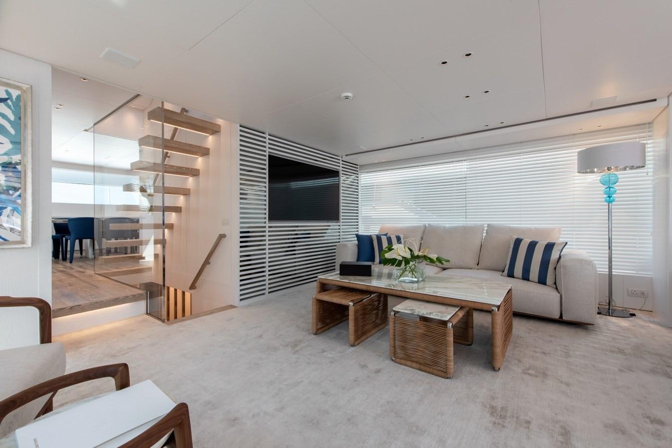 a living room with a couch and a table aboard AGNES Yacht for Sale
