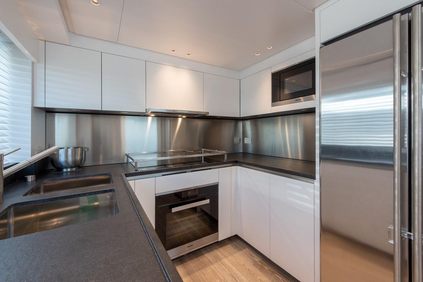 a kitchen with stainless steel appliances aboard AGNES Yacht for Sale