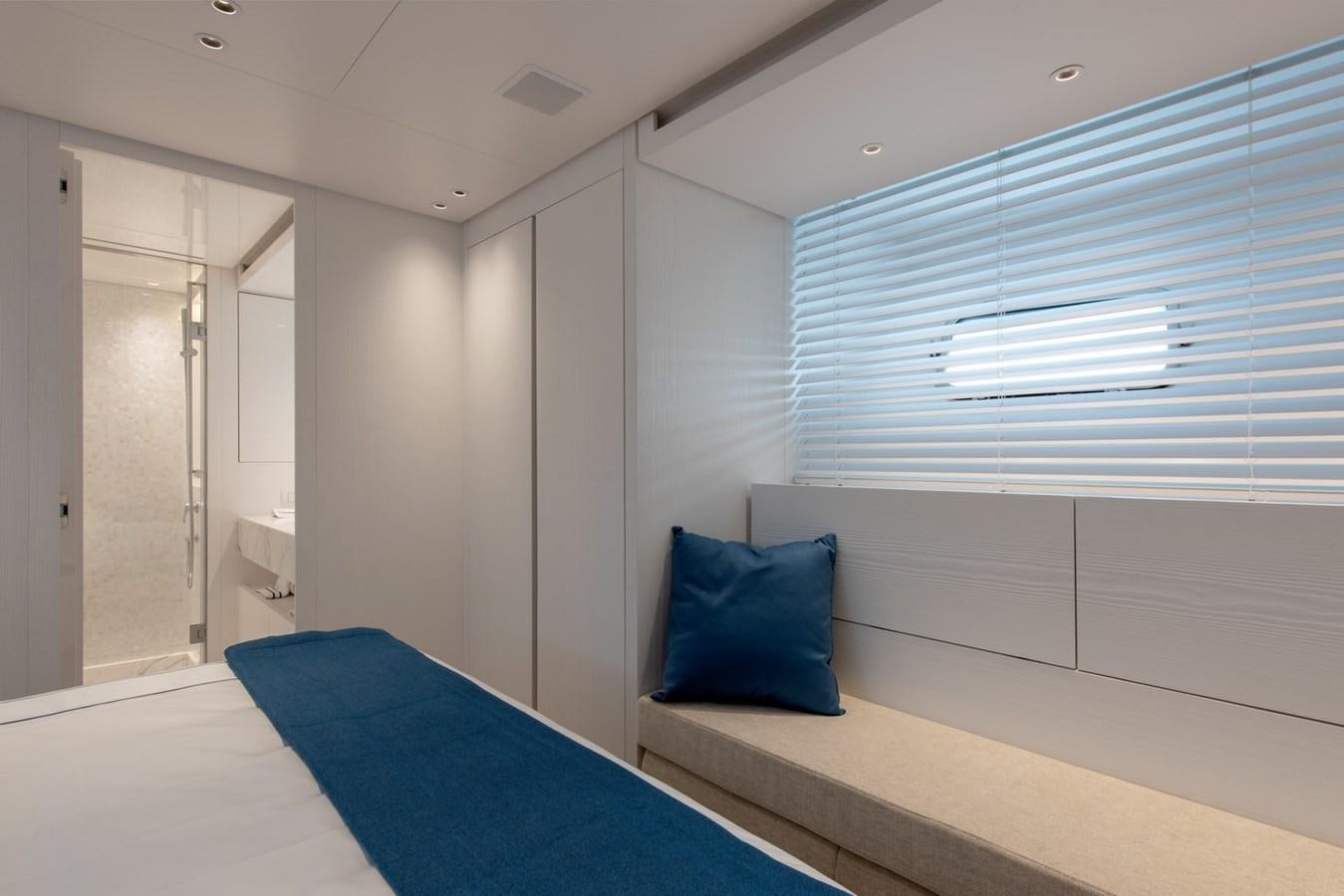 a room with a bed and a window aboard AGNES Yacht for Sale