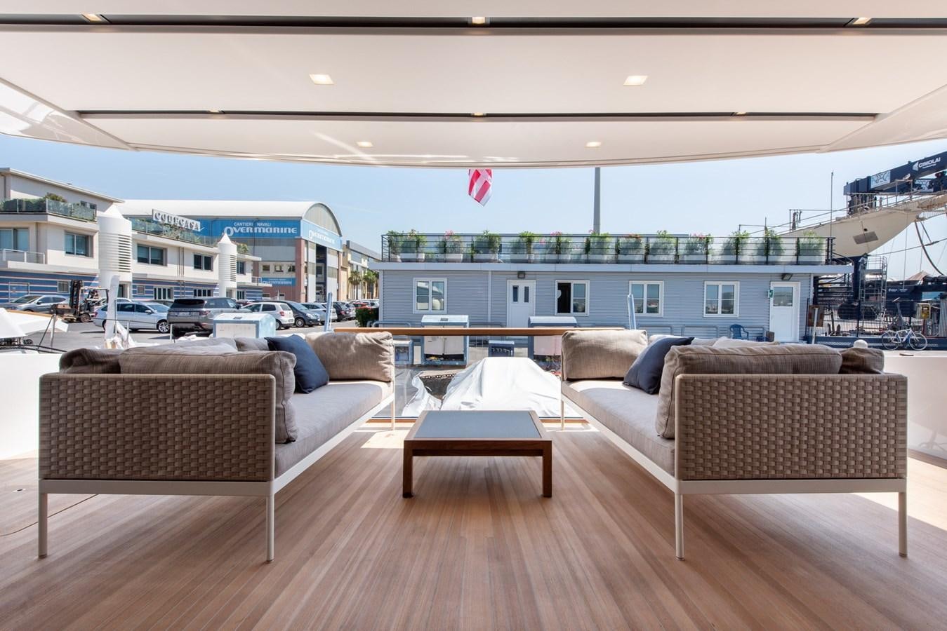 a large living room with a large balcony aboard AGNES Yacht for Sale