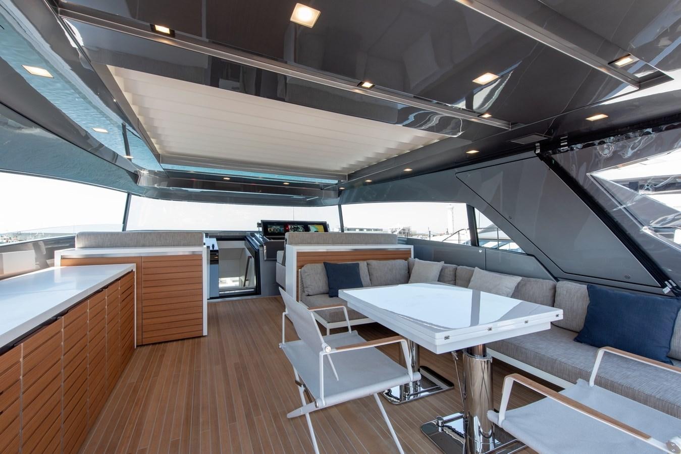 a room with tables and chairs aboard AGNES Yacht for Sale