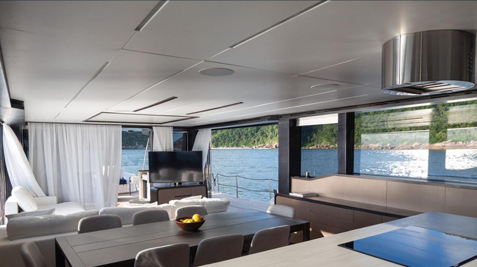 a room with a couch and a table and chairs aboard OKEAN 80/01 Yacht for Sale