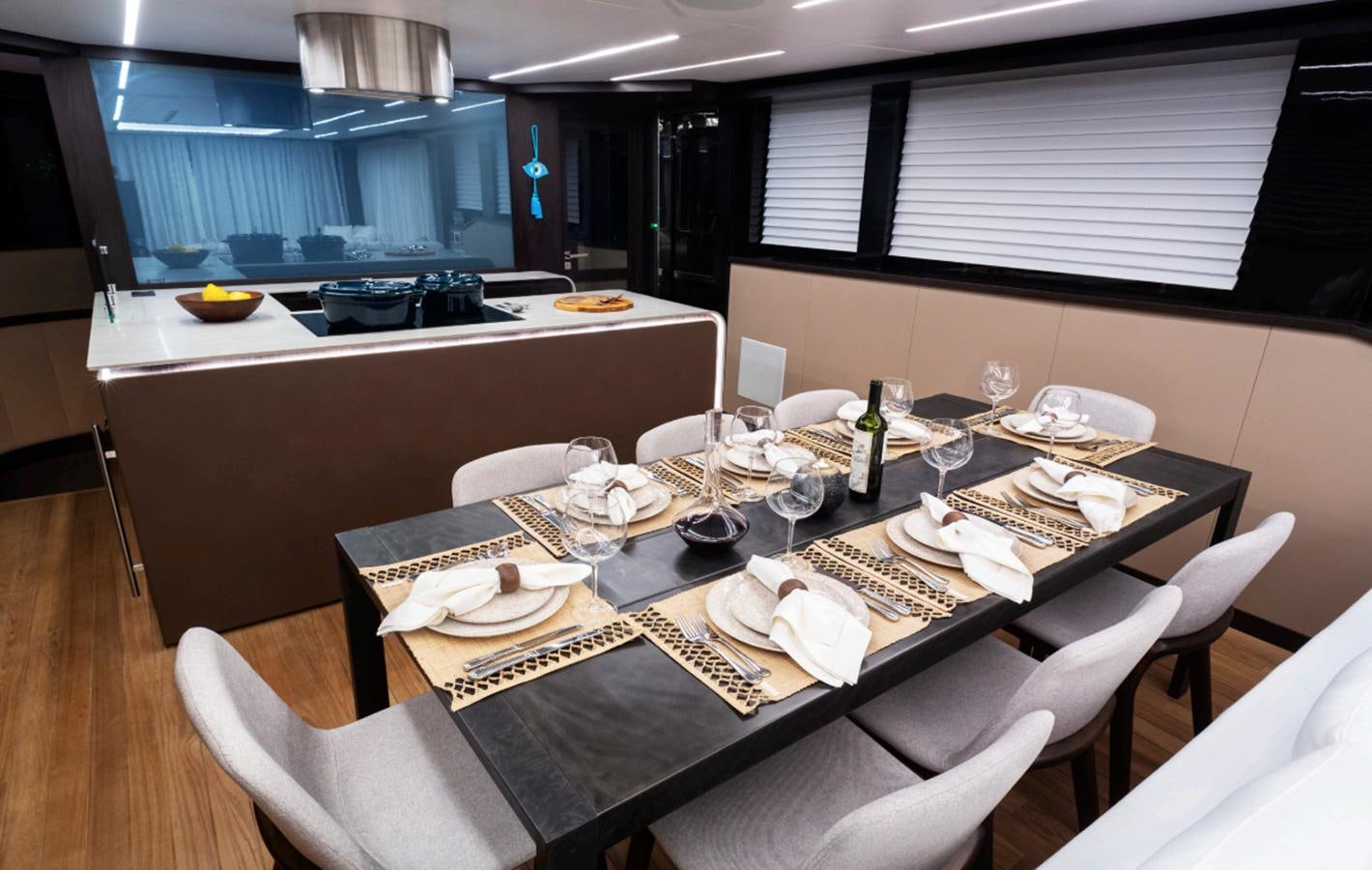 a dining room with a table set aboard OKEAN 80/01 Yacht for Sale
