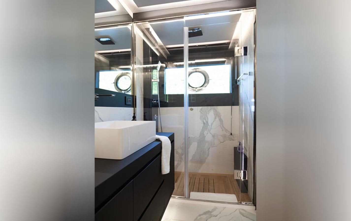 a room with a sink and a mirror aboard OKEAN 80/01 Yacht for Sale