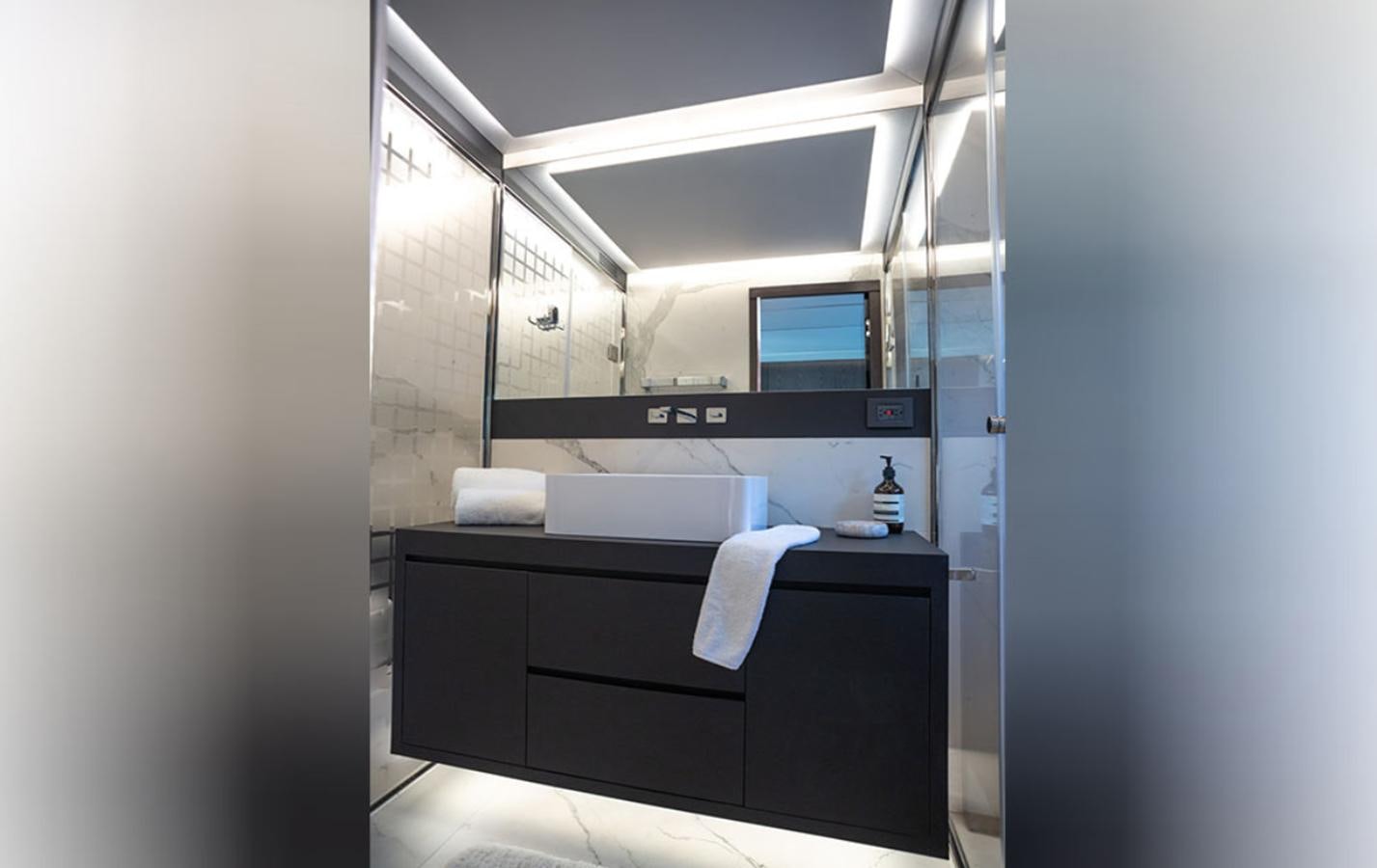a bathroom with a countertop sink and cabinets aboard OKEAN 80/01 Yacht for Sale