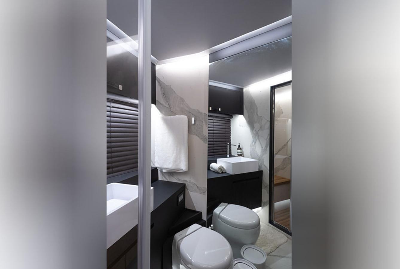 a bathroom with a toilet and a sink aboard OKEAN 80/01 Yacht for Sale