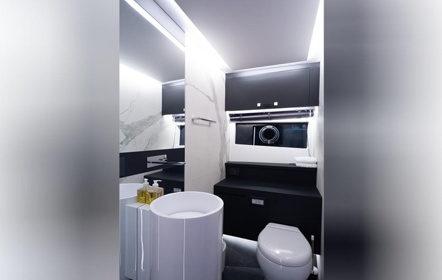 a bathroom with a toilet and a sink aboard OKEAN 80/01 Yacht for Sale