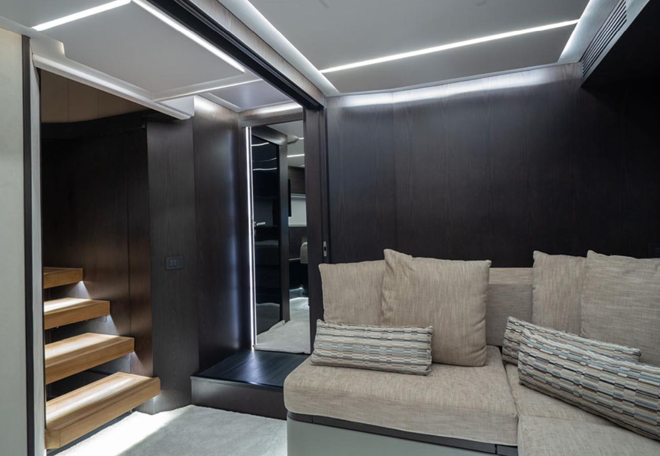 a room with a couch and a table aboard OKEAN 80/01 Yacht for Sale