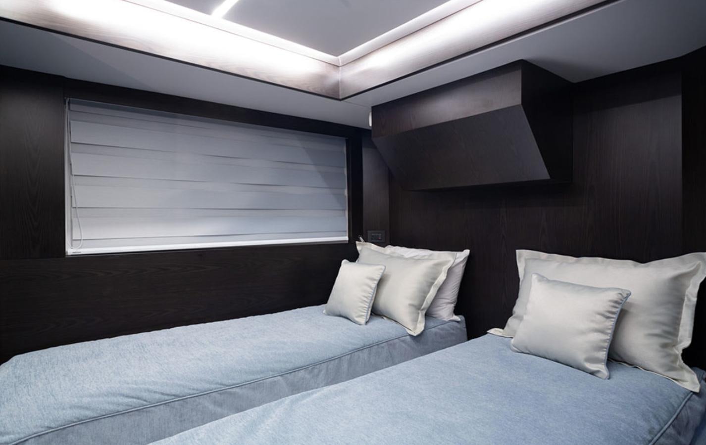 a bed with pillows aboard OKEAN 80/01 Yacht for Sale