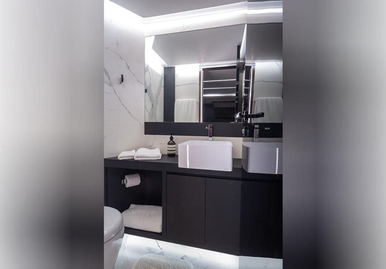 a bathroom with a sink and a mirror aboard OKEAN 80/01 Yacht for Sale