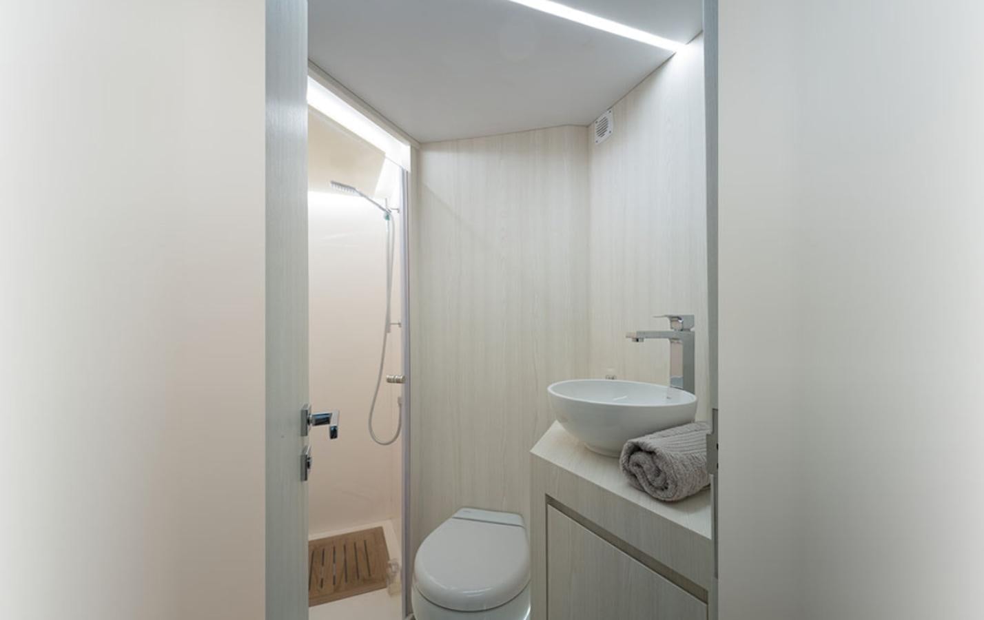 a bathroom with a sink and toilet aboard OKEAN 80/01 Yacht for Sale