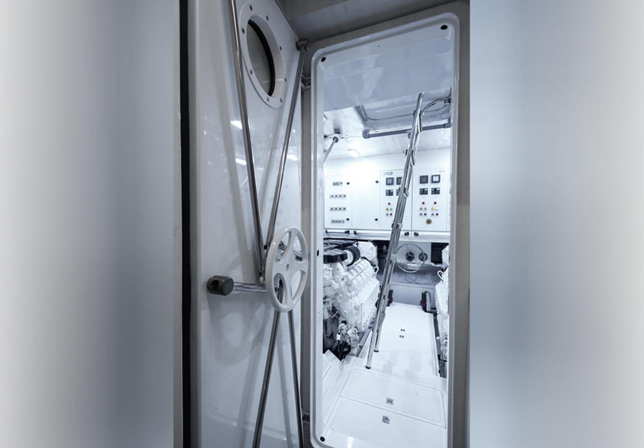 a machine with a door open aboard OKEAN 80/01 Yacht for Sale