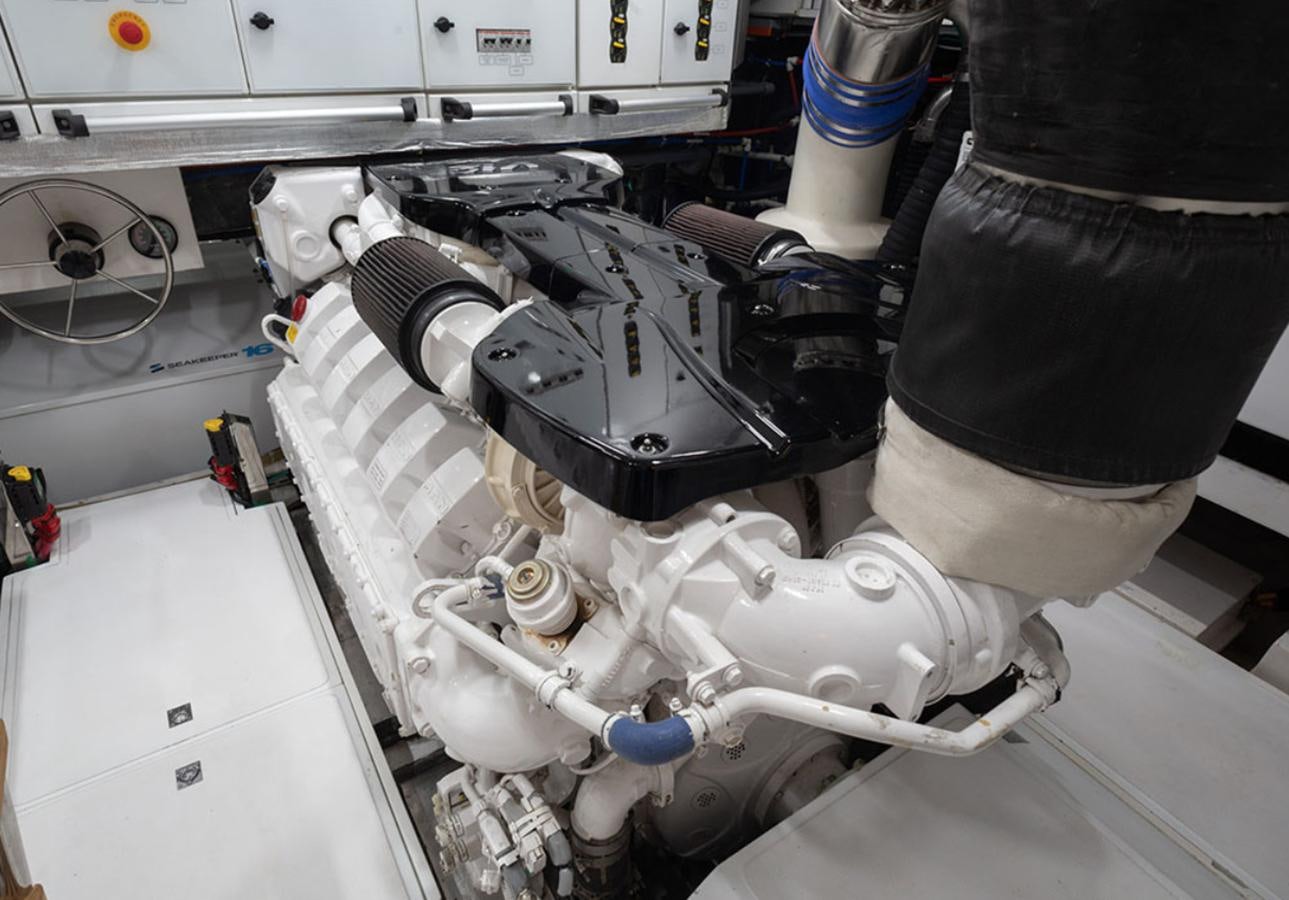 a person working on a machine aboard OKEAN 80/01 Yacht for Sale