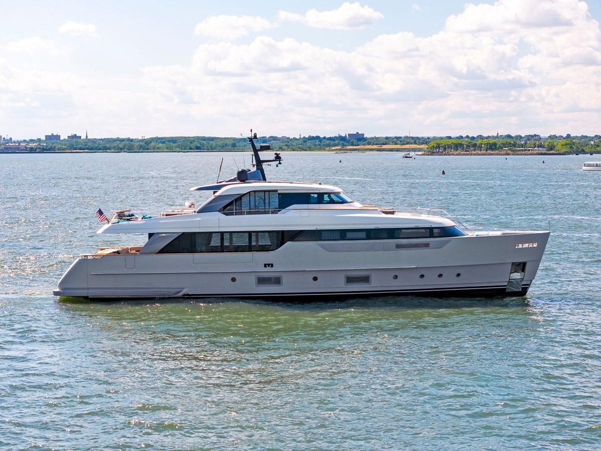 a white yacht in the water aboard DON'T TELL MOM Yacht for Sale