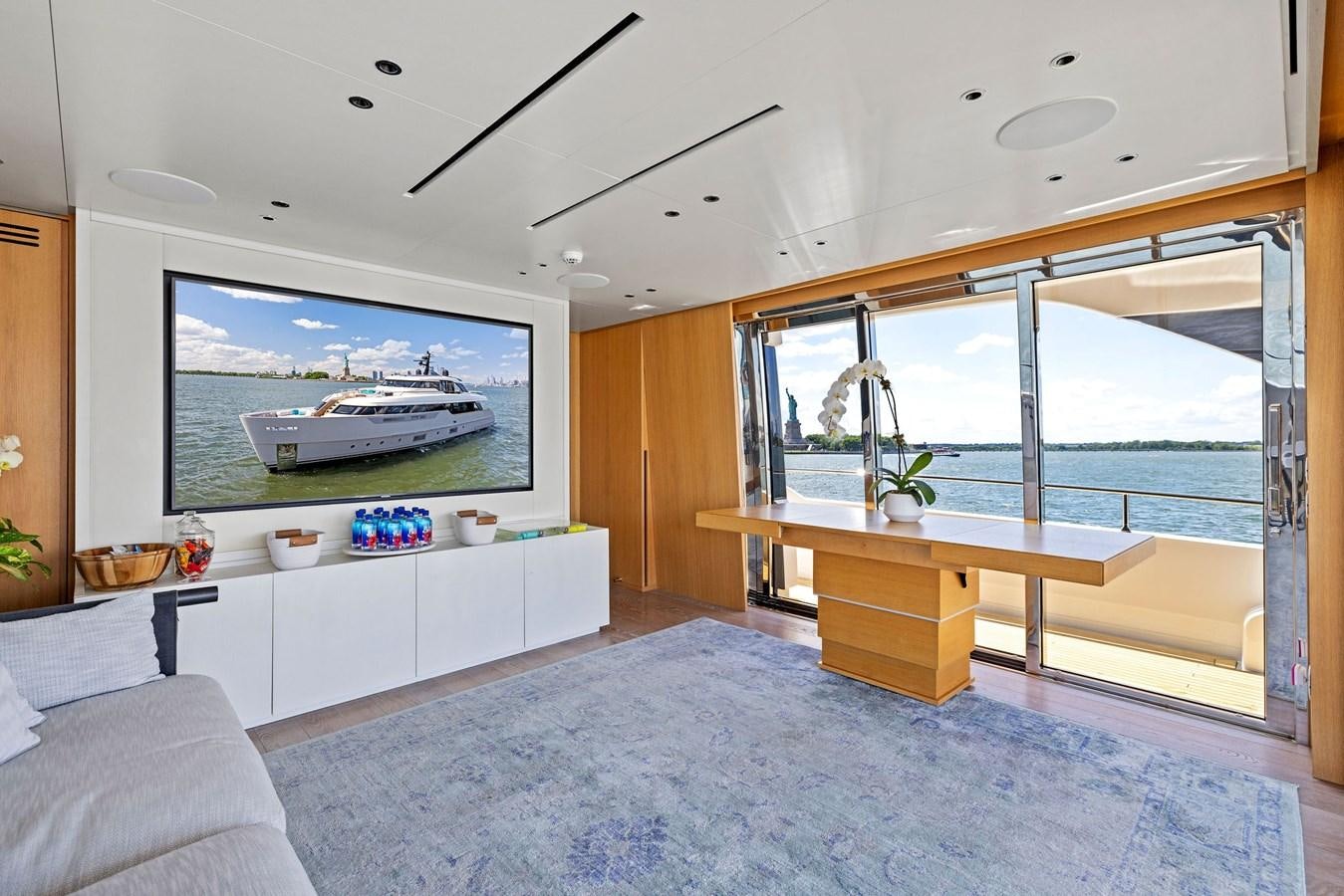 a room with a large window and a large television aboard DON'T TELL MOM Yacht for Sale