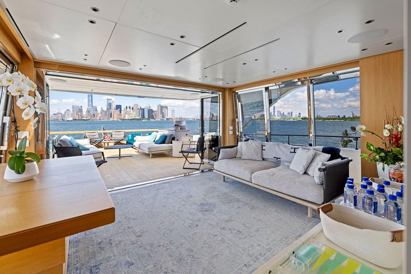 a living room with a large swimming pool aboard DON'T TELL MOM Yacht for Sale