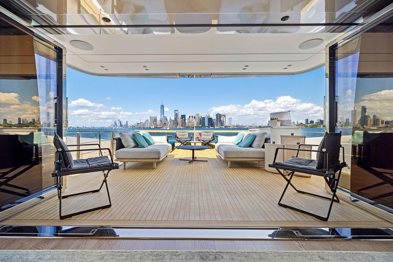 a room with a view of a city and a large body of water aboard DON'T TELL MOM Yacht for Sale