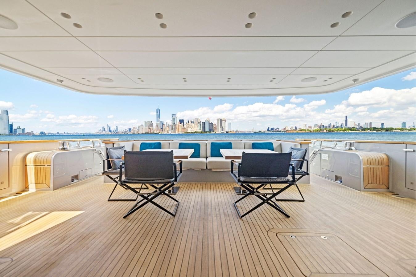 a room with chairs and a view of the water aboard DON'T TELL MOM Yacht for Sale