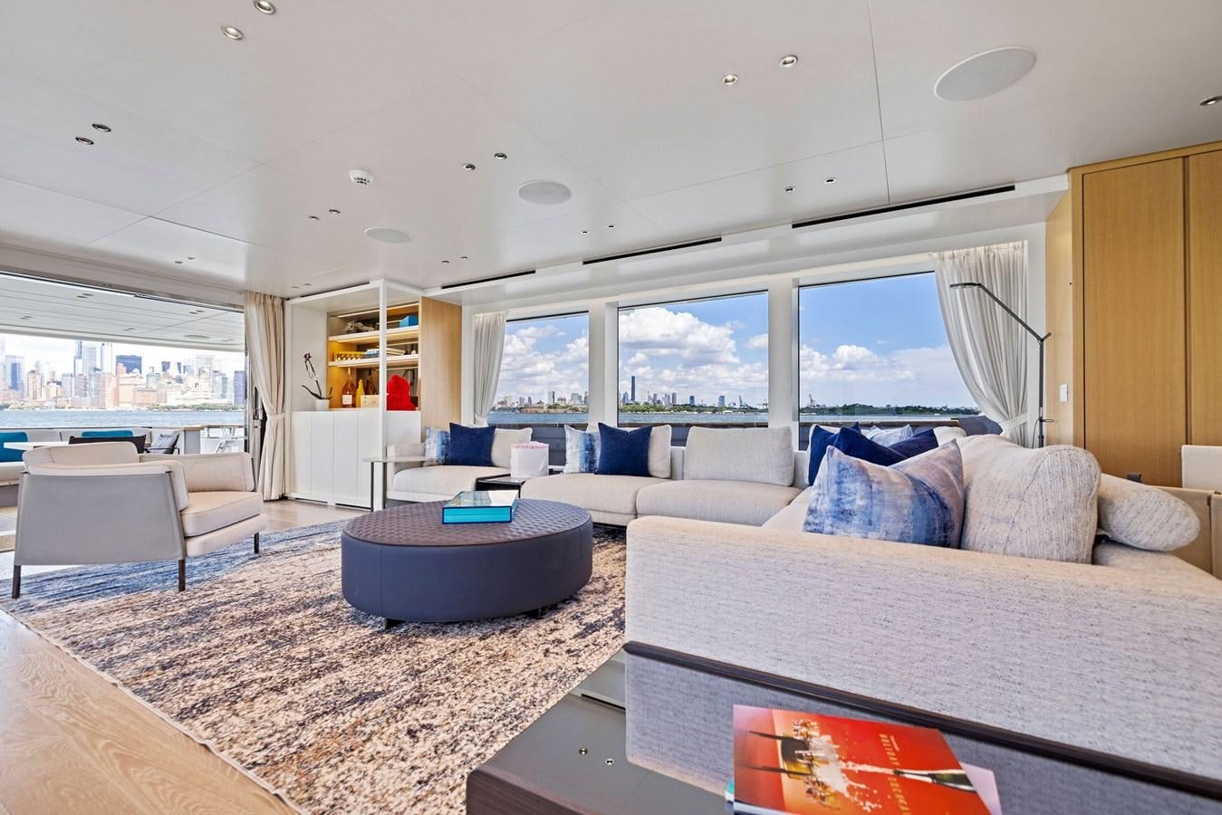 a living room with a large window aboard DON'T TELL MOM Yacht for Sale