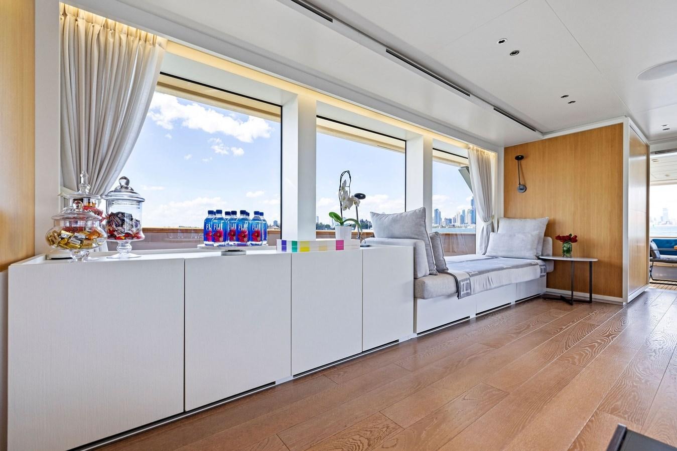 a living room with a large window aboard DON'T TELL MOM Yacht for Sale