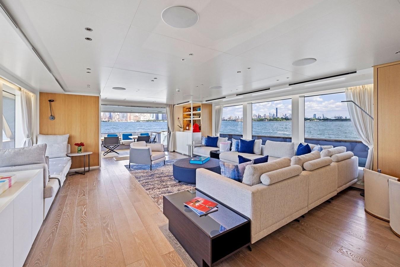 a living room with a large window aboard DON'T TELL MOM Yacht for Sale