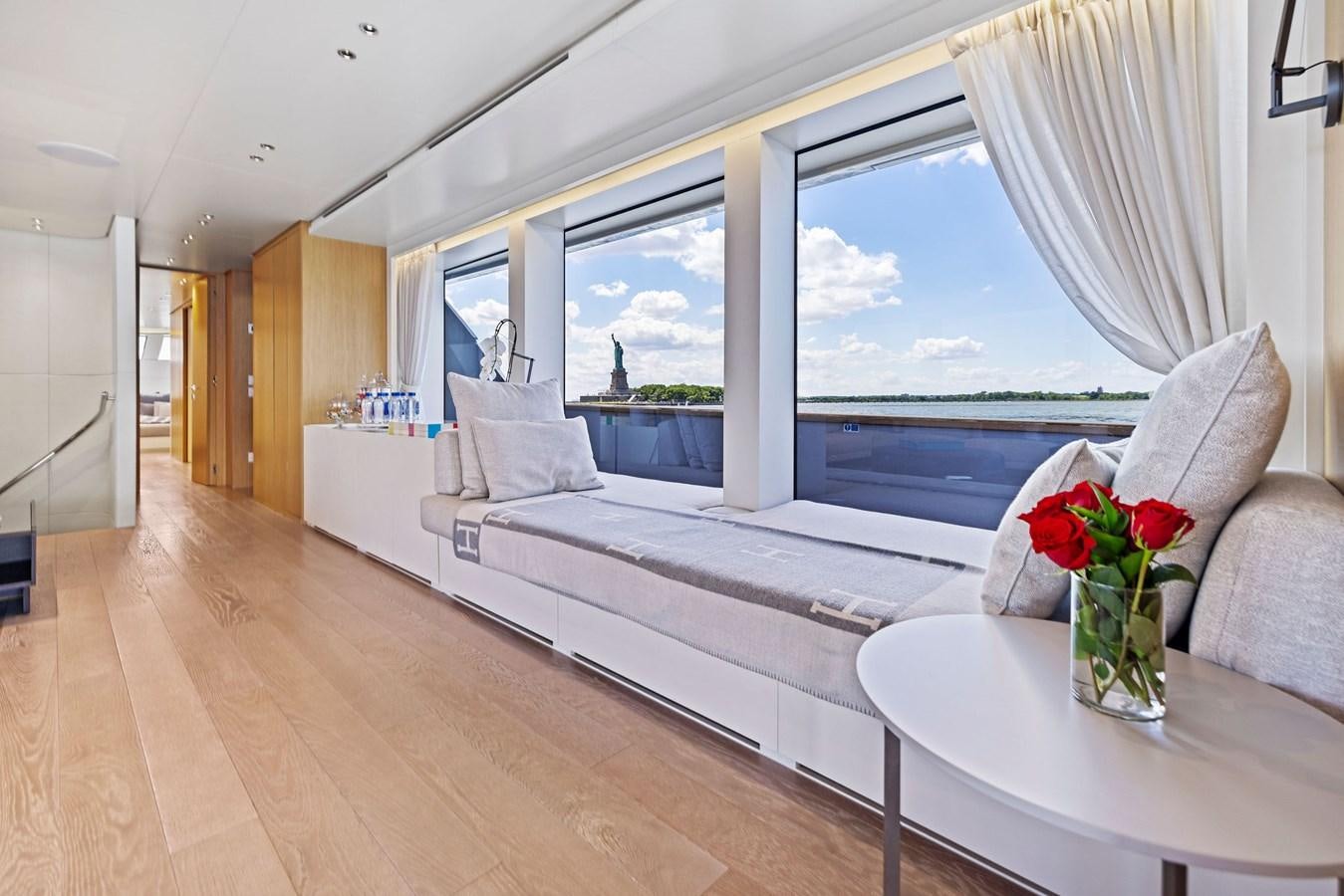 a living room with a large window aboard DON'T TELL MOM Yacht for Sale