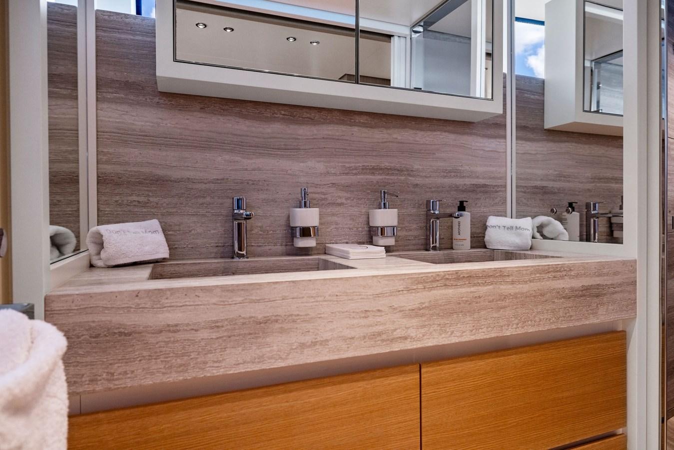 a bathroom with a large mirror aboard DON'T TELL MOM Yacht for Sale