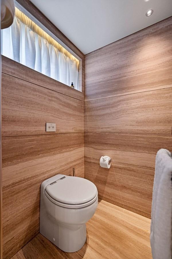 a toilet in a wooden room aboard DON'T TELL MOM Yacht for Sale