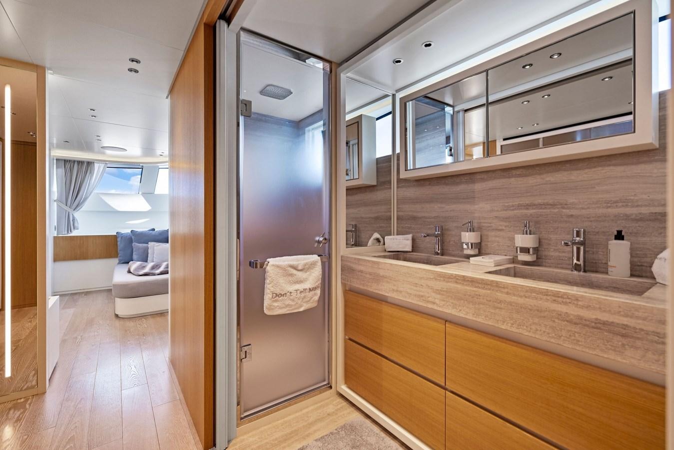 a bathroom with a large mirror aboard DON'T TELL MOM Yacht for Sale