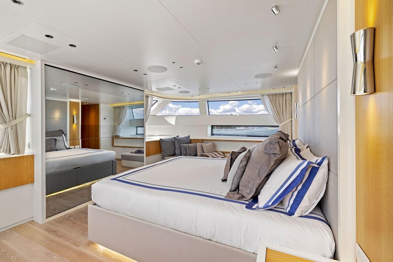 a large bed in a room aboard DON'T TELL MOM Yacht for Sale