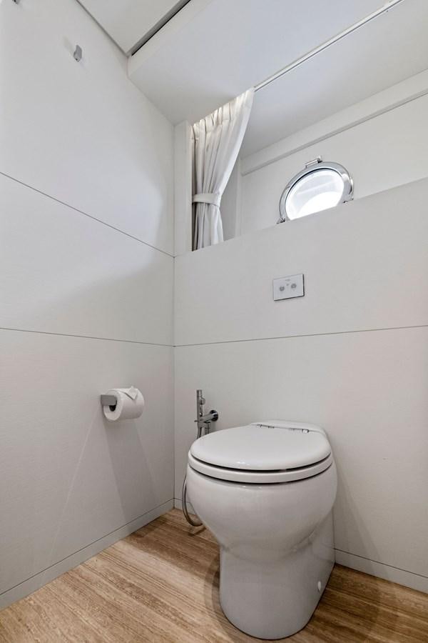 a toilet in a bathroom aboard DON'T TELL MOM Yacht for Sale