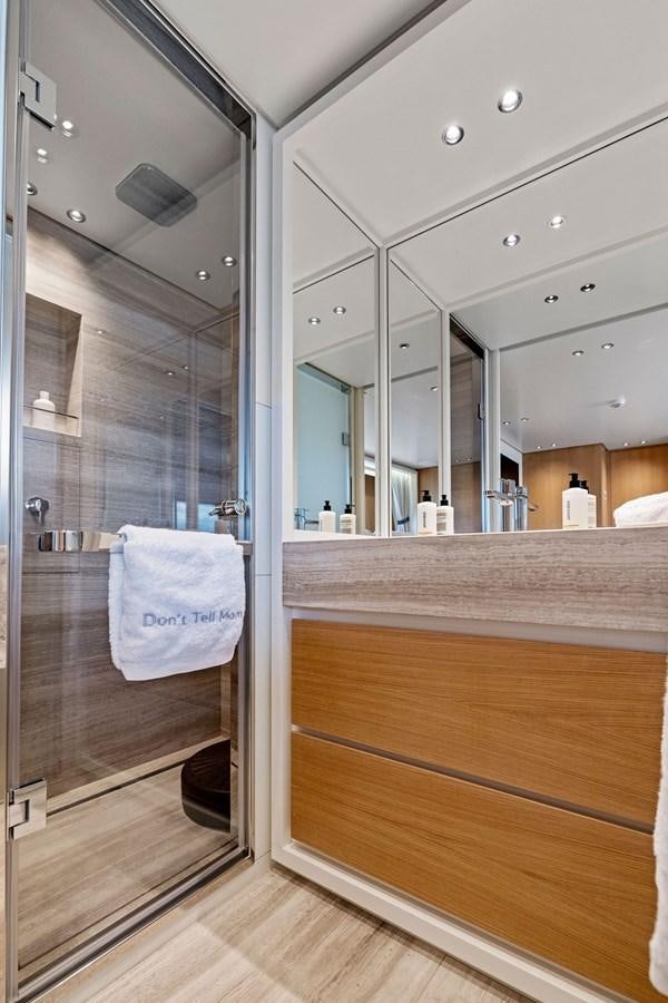 a bathroom with a large mirror aboard DON'T TELL MOM Yacht for Sale