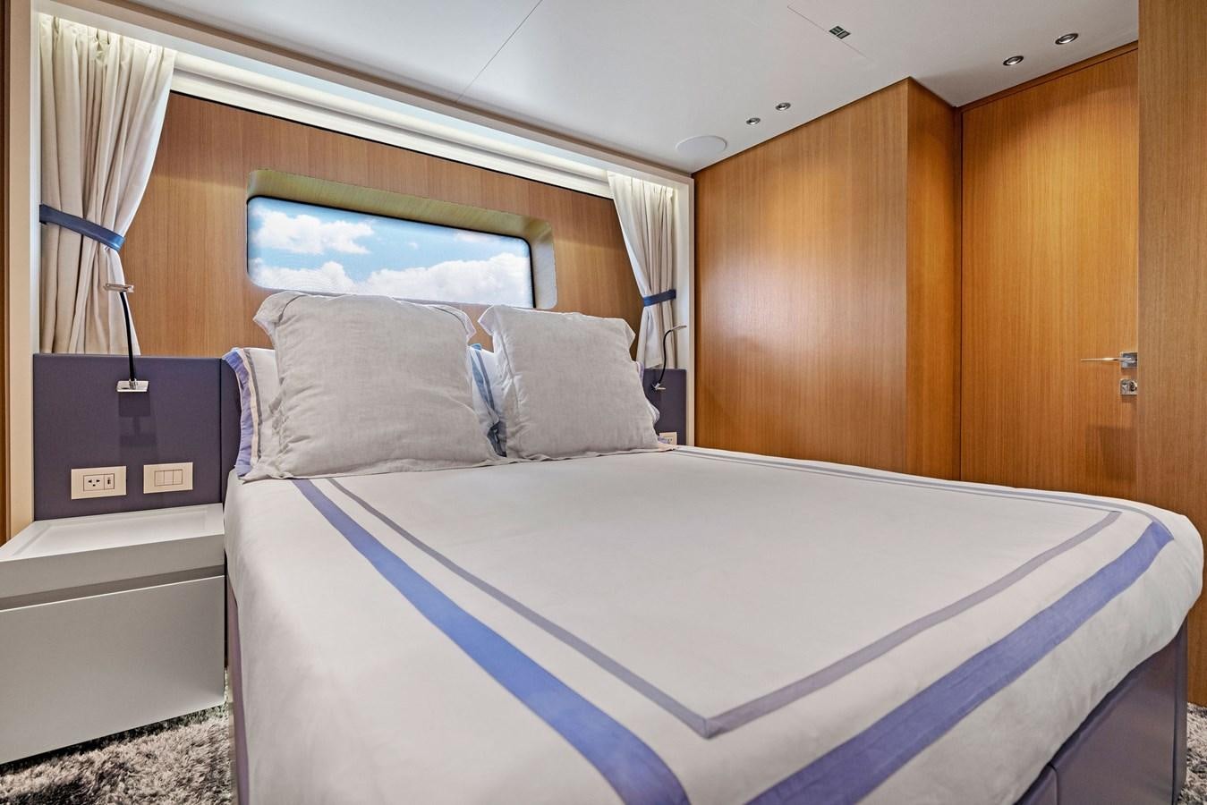 a bed with blue sheets aboard DON'T TELL MOM Yacht for Sale