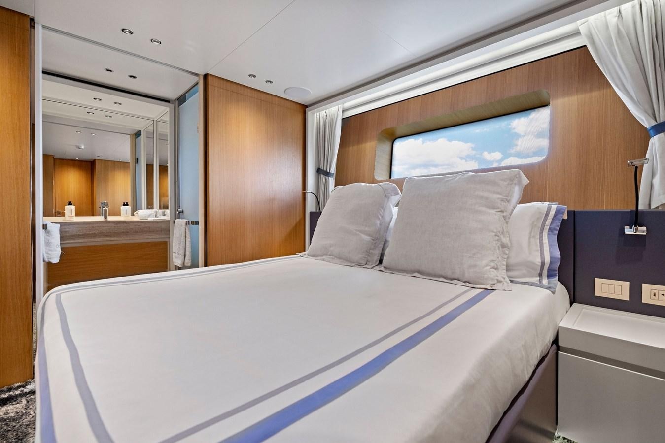 a bed with white sheets aboard DON'T TELL MOM Yacht for Sale