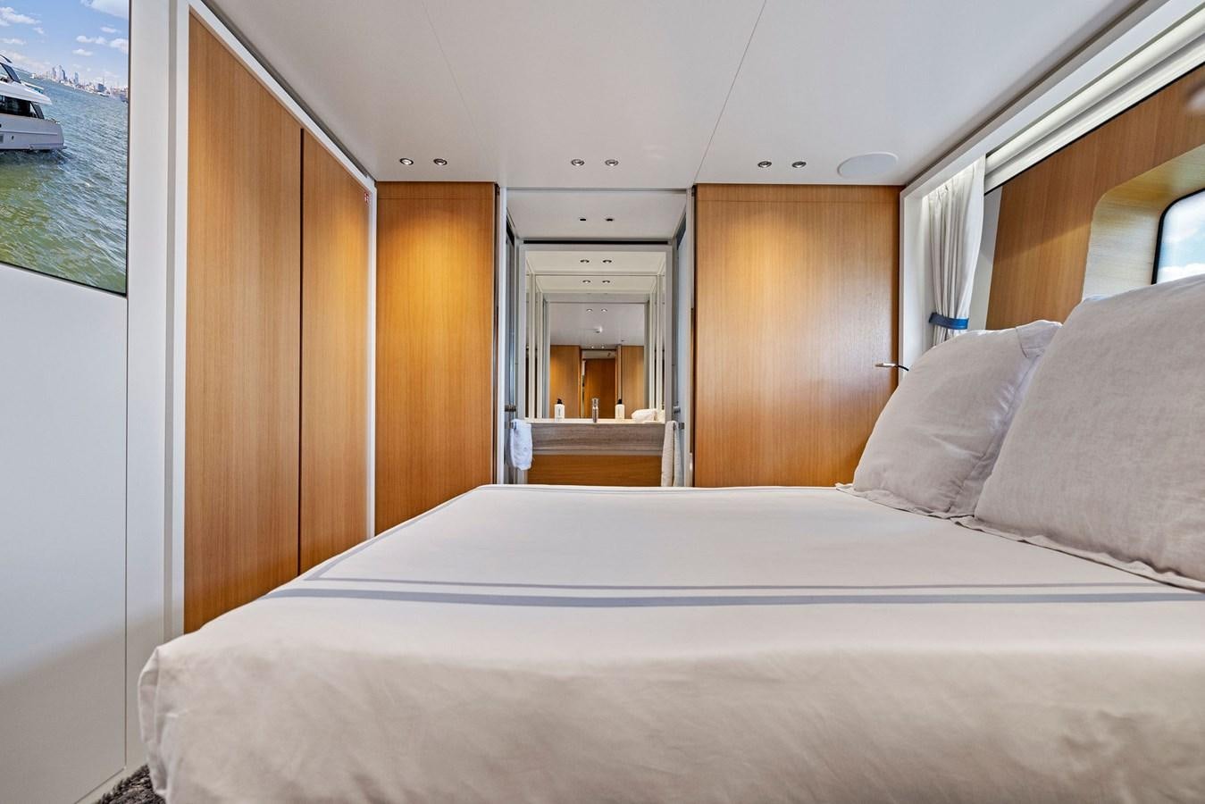 a bed with white sheets aboard DON'T TELL MOM Yacht for Sale