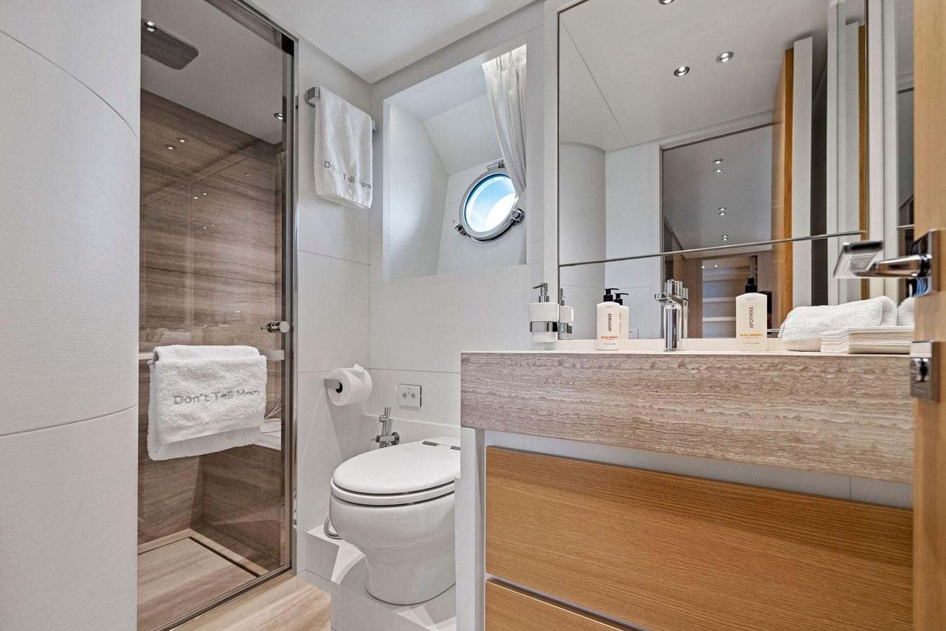 a bathroom with a glass shower aboard DON'T TELL MOM Yacht for Sale
