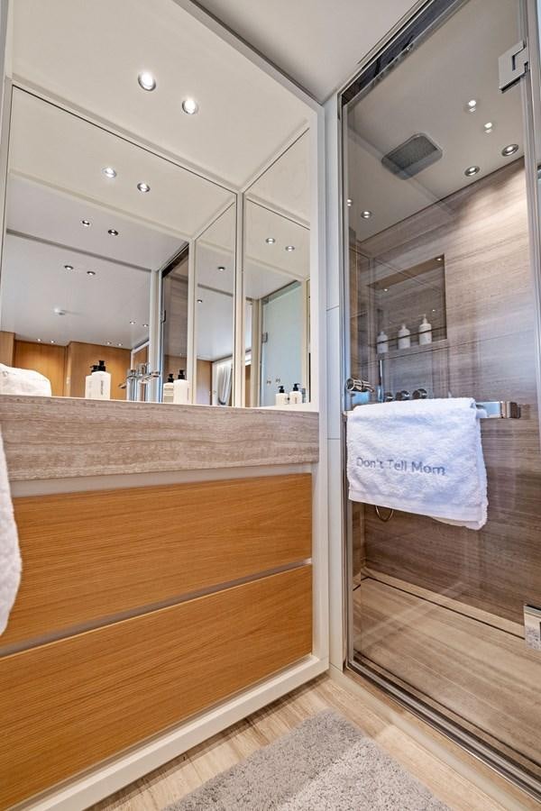 a bathroom with a large mirror aboard DON'T TELL MOM Yacht for Sale