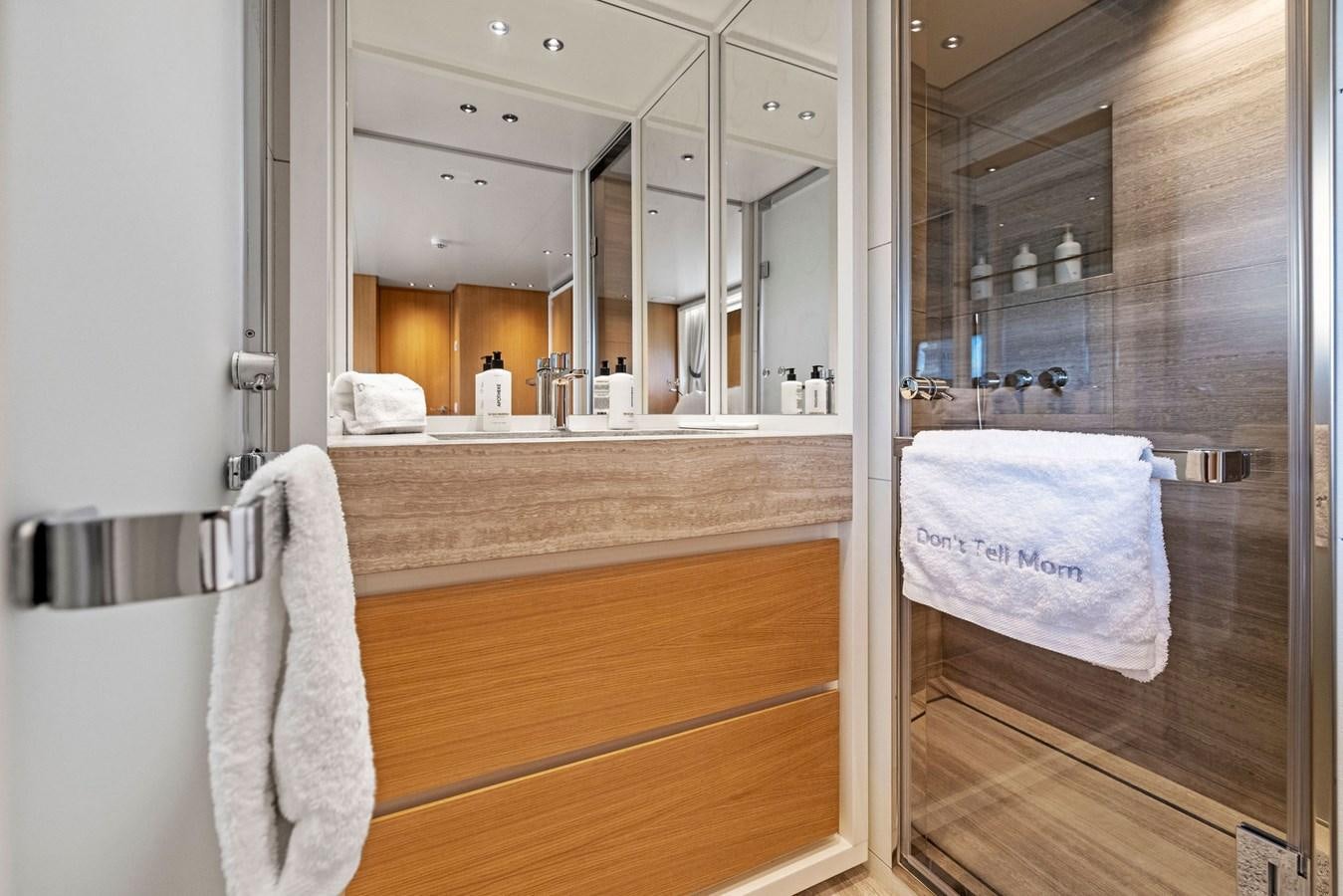 a bathroom with a large mirror aboard DON'T TELL MOM Yacht for Sale