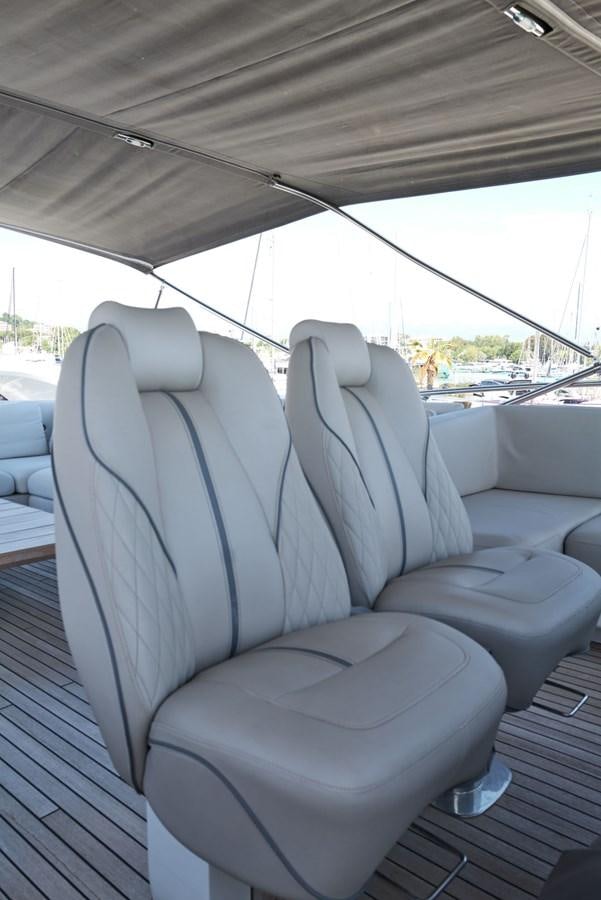 a tent with a seat and a seat aboard PRINCESS M Yacht for Sale